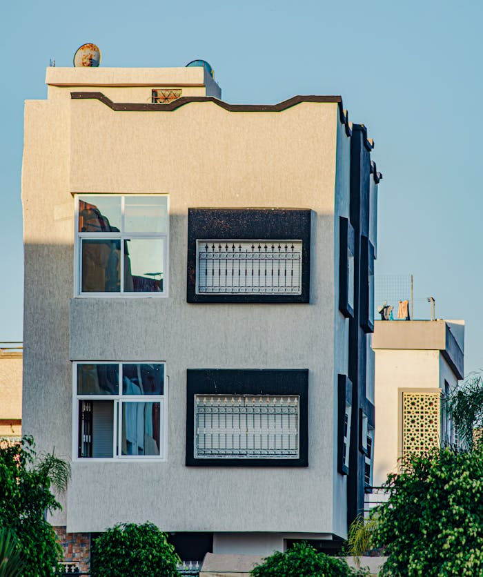 Contemporary urban building exterior with large windows and geometric design.